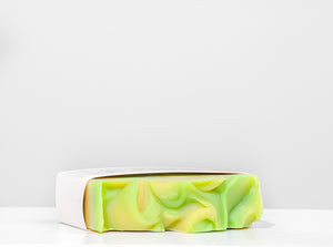 Green and yellow soap bar on a white background